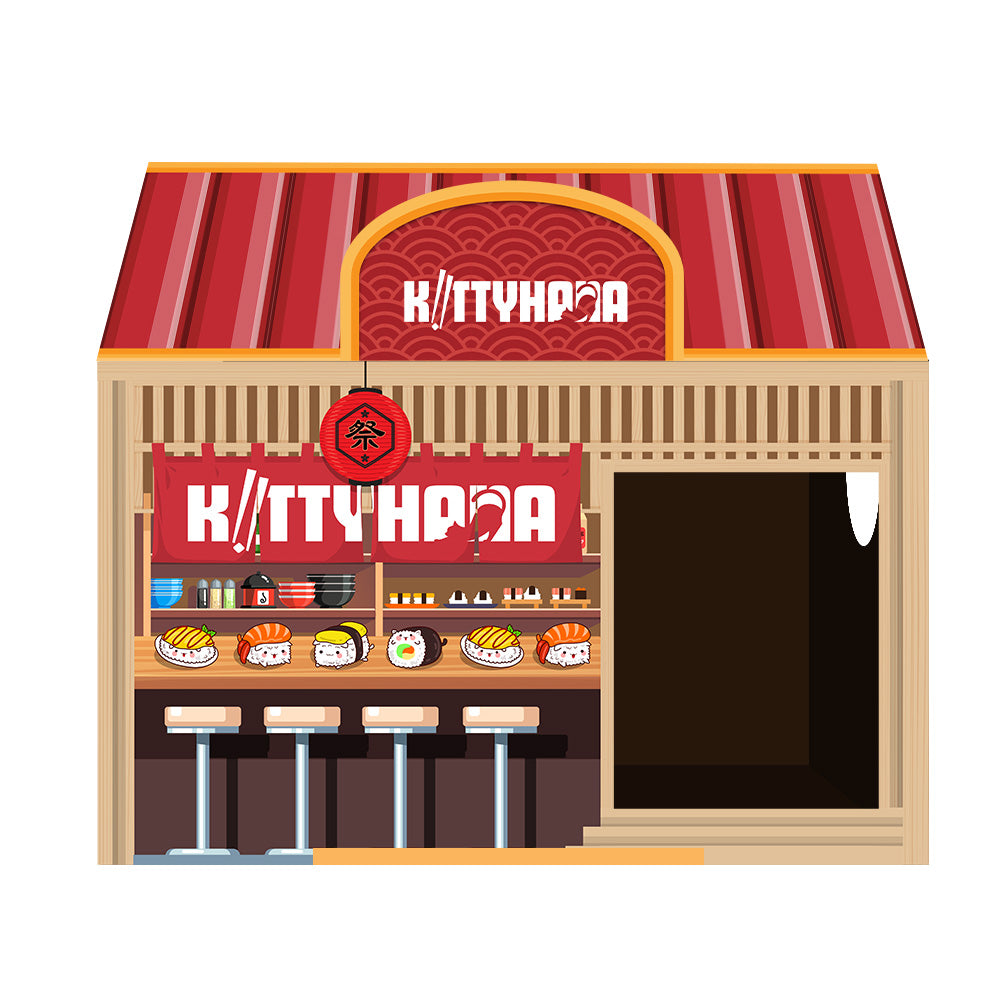 Cardboard cat house designed to look like a convenience store facade, featuring a red striped roof, a large open doorway on the right, and printed store signage and shelves with products on the left side.