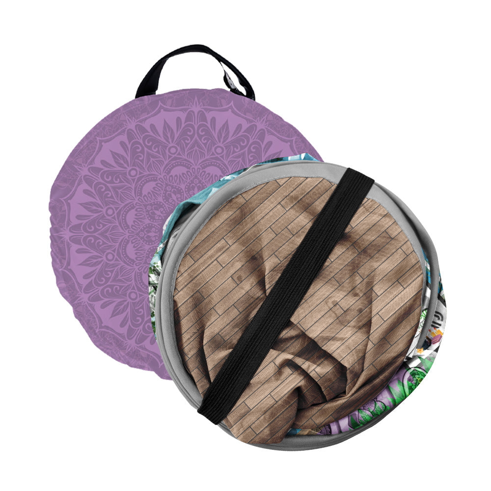 Folded purple pet tent with carry handle and black strap