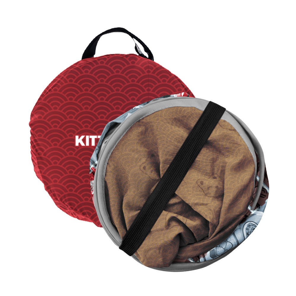 Folded red portable cat house with carrying handle